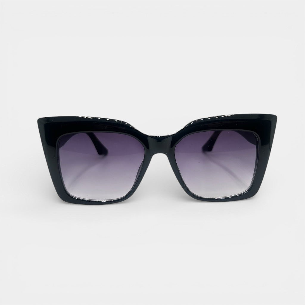 Black cat-eye sunglasses with gradient purple lenses on a grey background
